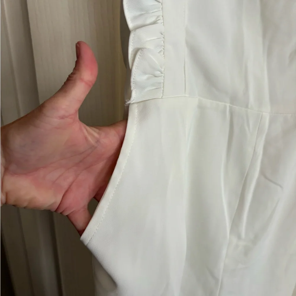New without tags off-white jumpsuit. Size medium.‎